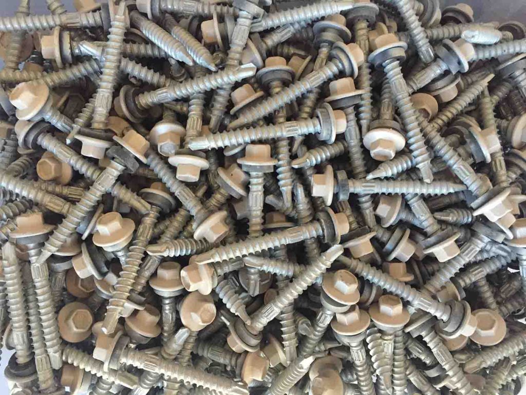 container full of metal screws